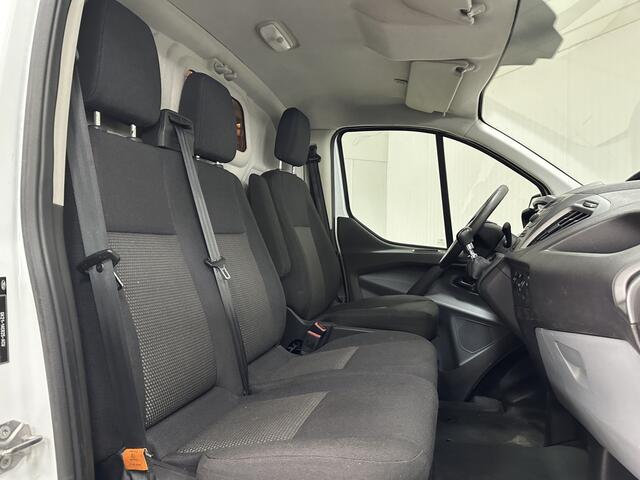 Ford TRANSIT CUSTOM 290 2.0 TDCI L2H1 Ambiente/ 3-Zitplaatsen voor!/ Trekhaak/ Zij-Schuifdeur rechts/ Airco/ Elek. pakket/ Bluetooth/ Armsteun/ Multi. Stuur/ AUX & USB/ Dagrijverl.