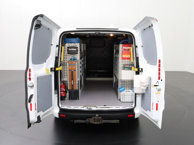 Ford TRANSIT CUSTOM 2.0TDCI | 2xSchuifdeur | Werkplaatsinrichting | 3-Persoons | Airco | Cruise | Trekhaak