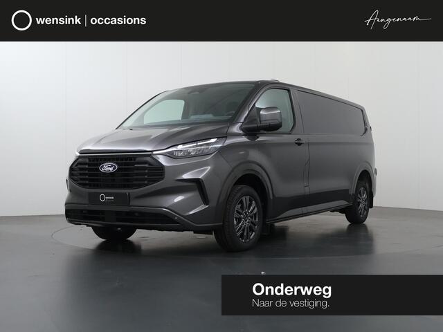 Ford TRANSIT CUSTOM 320 | 2.0 TDCI | Aut. | L2 H1 | Limited | ADAPTIVE CRUISE | STOELVERWARMING | CAMERA | NAVIGATIE | CLIMATE CONTROL | LAADRUIMTE PAKKET | LED LAMPEN | KEYLESS ENTRY | KEYLESS START