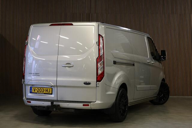 Ford TRANSIT CUSTOM 290 2.0 TDCI 170 PK L2H1 Limited | Standkachel | Navigatie | Stoelverwarming | Camera | Cruise control | Trekhaak | NAP Logisch | Dakdragers | Airco | 3-Zitter