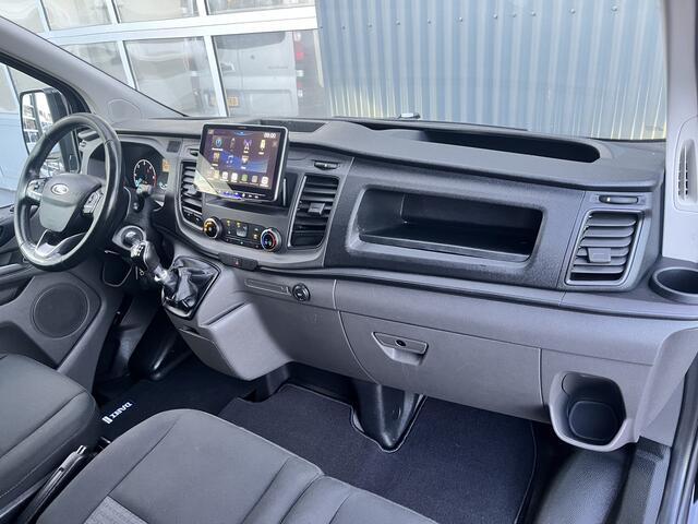 Ford TRANSIT CUSTOM 300 2.0 TDCI L2H1 Sortimo kastinrichting Airco Cruise control Trekhaak 2640kg trekgewicht 3-Persoons Stoelverwarming Bluetooth handsfree Parkeersensoren achter Schuifdeur links en rechts Euro 6