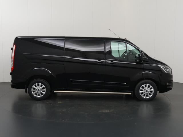 Ford TRANSIT CUSTOM 300 2.0 TDCI | L2 H1 | LIMITED | DUBBEL CABINE | AUT. | LEDEREN BEKLEDING | CAMERA | ADAPTIEVE CRUISE | STOELVERWARMING | NAVIGATIE | BI-XENON | 2X ZIJSCHUIFDEUR | AGATE BLACK METALLIC