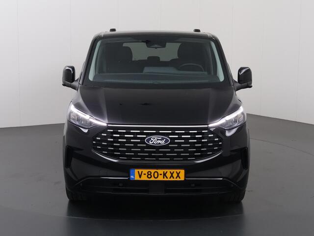 Ford TRANSIT CUSTOM TOURNEO | 320 2.0 TDCI | L2 H1 | 170 PK | TITANIUM X | 360 CAMERA | ADAPTIVE CRUISE | STOELVERWARMING | LEDER | STUURWIELVERWARMING | NAVIGATIE | CLIMATE CONTROL | BLIND-SPOT | 2500 KG AHW TREKHAAK | 19" LICHTMETALEN VELGEN