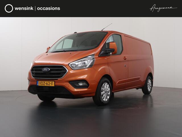 Ford TRANSIT CUSTOM 300 | 2.0 TDCI | AUT. | L2 H1 | LIMITED | NL AUTO | DEALER ONDERHOUDEN | STOELVERWARMING | CRUISE CONTROL | AIRCO | PARKEERSENSOREN | METALLIC | ORANGE GLOW