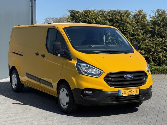 Ford TRANSIT CUSTOM 2.0 TDCI / L2H1 / 1e EIG. / AIRCO / CRUISE / 2.8 TONS TREKHAAK / STOELVERW / PDC / DAKDRAGERS