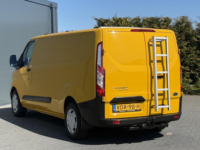 Ford TRANSIT CUSTOM 2.0 TDCI / L2H1 / 1e EIG. / AIRCO / CRUISE / 2.8 TONS TREKHAAK / STOELVERW / PDC / DAKDRAGERS