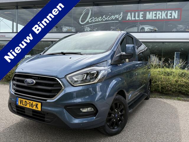 Ford TRANSIT CUSTOM 320 2.0 TDCI L2H1 Platinum Edition DC Automaat Achteruitrijcamera - Parkeersensoren - Navigatie - Airco - Dodehoek detector - Cruise control - Licht metalen velgen 16 inch - Lederen bekleding - Radio - Bluetooth - Dubbele cabine - Tussens - Mistlampen voo