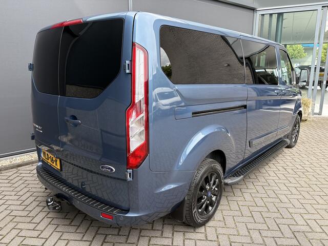 Ford TRANSIT CUSTOM 320 2.0 TDCI L2H1 Platinum Edition DC Automaat Achteruitrijcamera - Parkeersensoren - Navigatie - Airco - Dodehoek detector - Cruise control - Licht metalen velgen 16 inch - Lederen bekleding - Radio - Bluetooth - Dubbele cabine - Tussens - Mistlampen voo