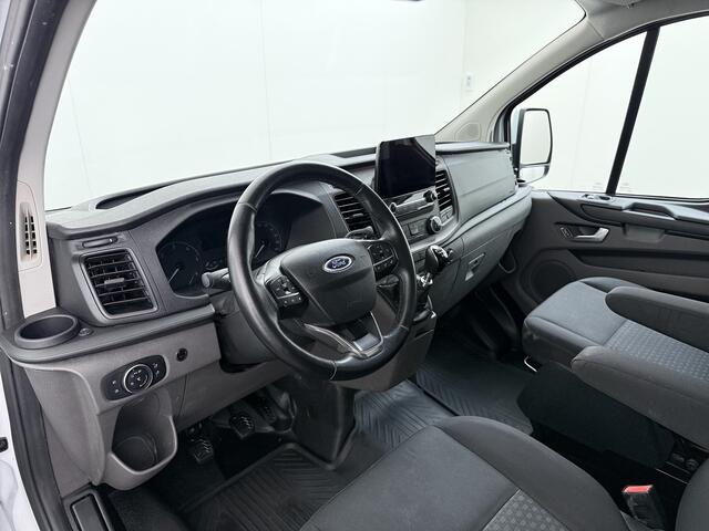 Ford TRANSIT CUSTOM 320 2.0TDCI 130PK L2H1 Camera Trekhaak Stoelverwarming Euro 6 Airco Navi Cruise Control Bluetooth Pdc Trend Sidebars Betonplex Vloer Wandbetimmering Inbouwkasten 2.800KG Trekgewicht Origineel Nederlandse Bus