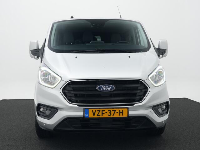 Ford TRANSIT CUSTOM 320 2.0 TDCI 130pk L2H1 Limited DC | Camera | Leer | El. verst. stoel | Stoelverw. | Voorruitverw. | 6-zits | Adapt. cruise | 100% dealer onderh.