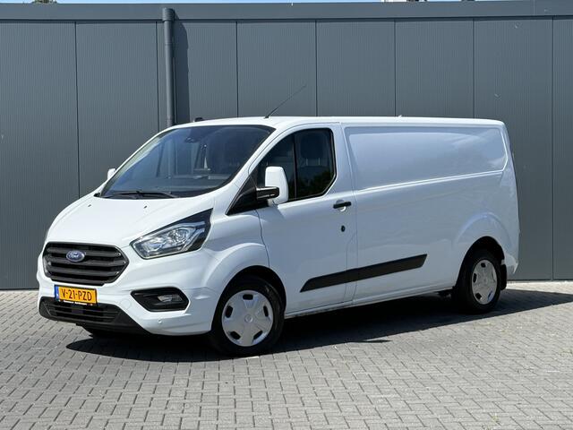 Ford TRANSIT CUSTOM 2.0 TDCI 130 PK / L2H1 / AUTOMAAT / TREKHAAK / AIRCO / CRUISE / CAMERA / 3-ZITS / LED / STOEL -EN VOORRUIT VERWARMING
