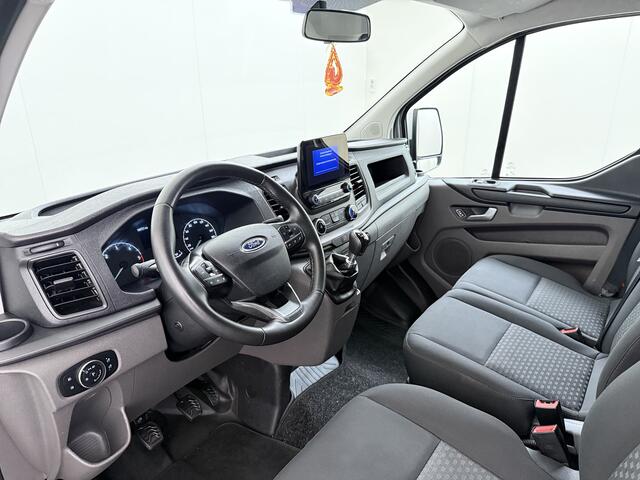 Ford TRANSIT CUSTOM 280 2.0TDCI 130PK Euro 6 L1H1 3-Persoons Navi Airco Cruise Control Bluetooth DAB Pdc Trend Betonplex Vloer Wandbetimmering Schuifdeur+Raam Achterdeuren+Ramen 1e Eigenaar