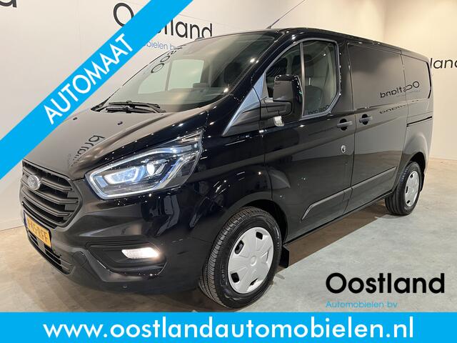 Ford TRANSIT CUSTOM 300 2.0 TDCI L1H1 Trend 130 PK Automaat / Euro 6 / Schuifdeur L + R / Airco / CarPlay / Cruise Control Adap. / Trekhaak / Xenon / Navigatie / 3-Zits / 27.300 KM !!
