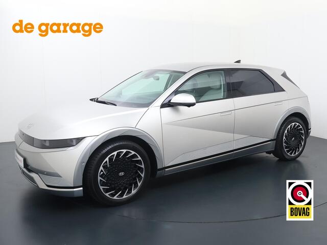 Hyundai IONIQ 5 Lounge 77.4 kWh | SoH 100% | Automaat | Multifunctioneel stuurwiel | Autohold | Automatische verlichting | Automatische achterklep | Inklapbare spiegels | Spraakbediening | Bluetooth | Stoelverwarming/Stoelventilatie | Climate | Navigatie | Apple Carpla