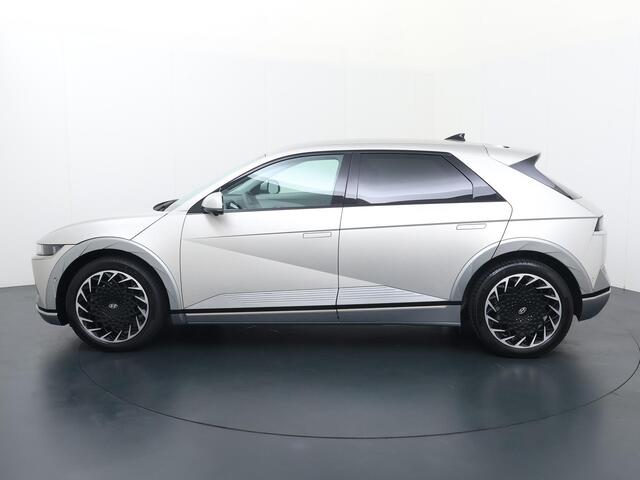 Hyundai IONIQ 5 Lounge 77.4 kWh | SoH 100% | Automaat | Multifunctioneel stuurwiel | Autohold | Automatische verlichting | Automatische achterklep | Inklapbare spiegels | Spraakbediening | Bluetooth | Stoelverwarming/Stoelventilatie | Climate | Navigatie | Apple Carpla