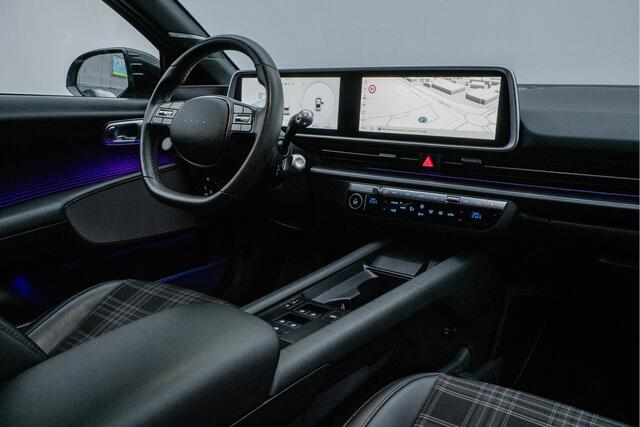 Hyundai IONIQ 6 First Edition AWD 77.4 kWh Schuifdak/ Camera/ Stoel-stuurverwarming/ Navigatie/ Carplay/ Memory/ 20" Lmv