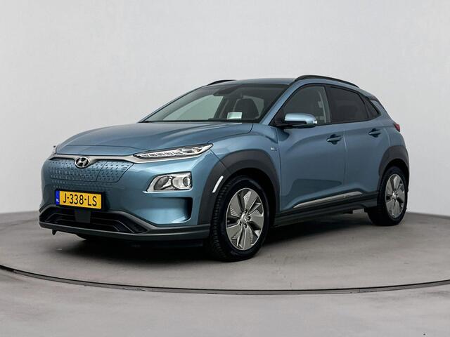 Hyundai Kona EV Fashion 64 kWh | Stoelverwarming | Parkeersensoren achter | Soh 96% | Navigatie |
