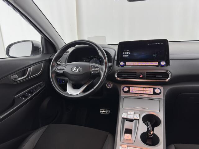Hyundai Kona EV Fashion 64 kWh (3-Fase) {SOH-100%} (INCL-BTW) Aut * HEATPUMP | NAVI-FULLMAP | LEATHER-FABRIC | KEYLESS | CAMERA | DAB | ECC | PDC | ADAPTIVE-CRUISE | LANE-ASSIST | HEATED SEATS | PRIVACY-GLASS | HEAD-UP | SHIFT-PADDLES | 17"A