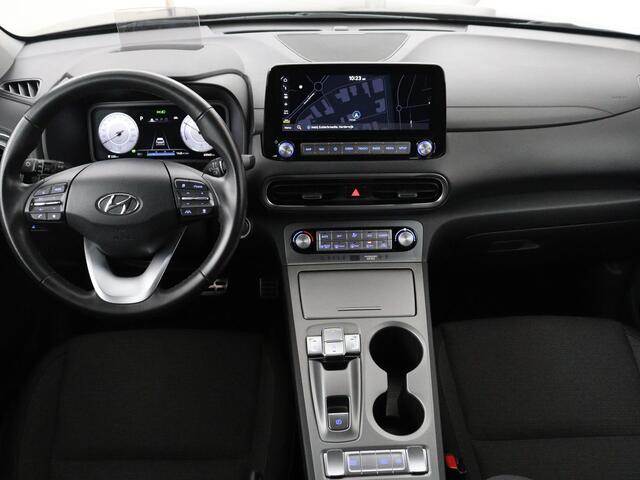 Hyundai Kona EV Fashion 64 kWh | SOH 100% | 3 Fase | Head-Up | Warmtepomp | Adaptive cruise | Camera | Carplay | Keyless | Full LED | Navigatie | Climate control
