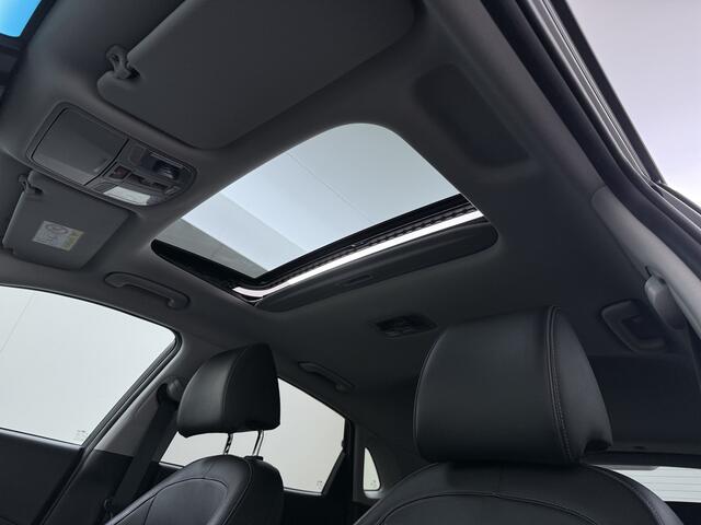 Hyundai Kona EV 64kWh 204pk SOH 100% Premium Schuif-/Kanteldak Leer Warmtepomp Head-Up Display Apple Carplay Android Navi Camera Elektr.Stoelen+Leer+Verwarmd+Gekoeld Adaptive Cruise/Stop&Go Zelfsturend Multimedia Forward-Collision-Avoidance-Assist (FCA)Led Keyless DAB