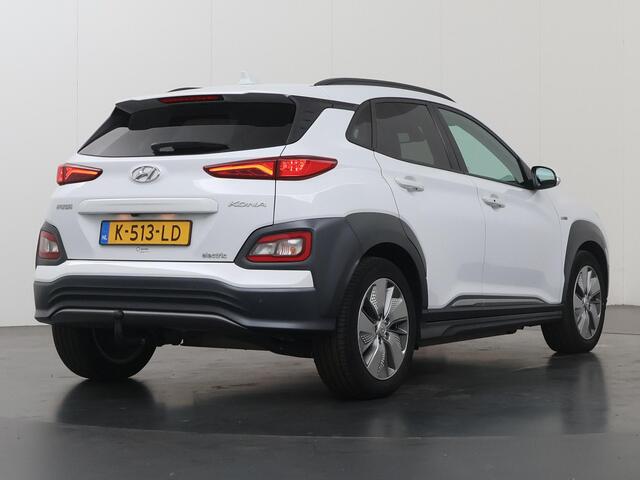 Hyundai Kona EV Limited 64 kWh | SOH 95% | Trekhaak | Lederen Interieur | Navigatie | Stoelverwarming voor + achter | HUD | Camera | DAB | Apple CarPlay/Android Auto | Stoelverwarming + koeling | Adaptieve Cruise Control | KRELL Audio |