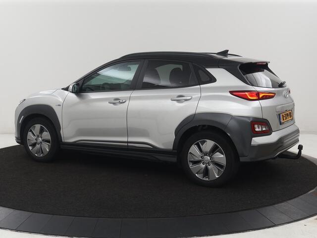 Hyundai Kona EV Fashion Design 64 kWh | SOH 94.6% | Leder | Head-up | Trekhaak | Adaptive cruise | Carplay | Stoelverwarming | Krell Sound | Dodehoek detectie |