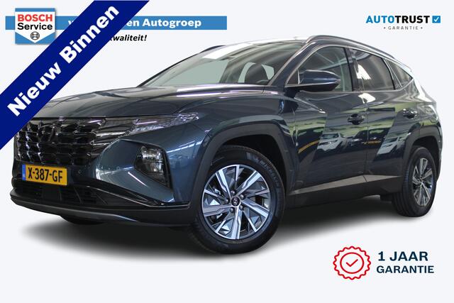 Hyundai TUCSON 1.6 T-GDI HEV Comfort Smart | Incl. 12 maanden garantie | Nieuwstaat | Achteruitrijcamera | Apple CarPlay | Stoel + stuurverwarming | Adaptive cruise | 1650 KG trekgewicht | F1 flippers | DAB radio | LED koplampen |