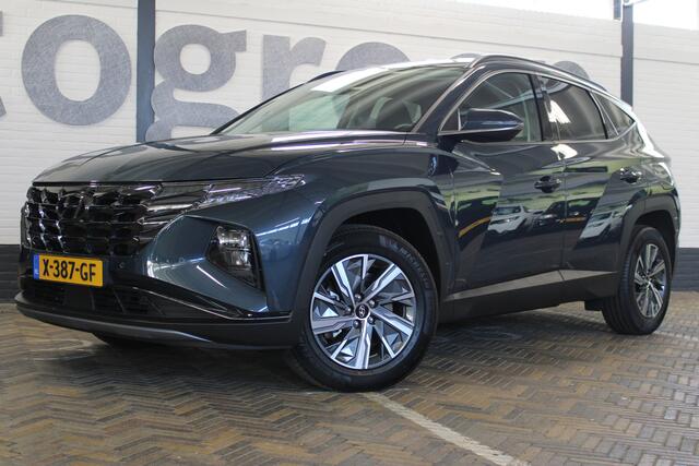 Hyundai TUCSON 1.6 T-GDI HEV Comfort Smart | Incl. 12 maanden garantie | Nieuwstaat | Achteruitrijcamera | Apple CarPlay | Stoel + stuurverwarming | Adaptive cruise | 1650 KG trekgewicht | F1 flippers | DAB radio | LED koplampen |