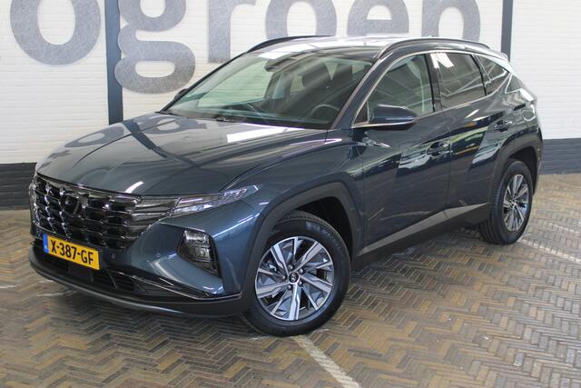 Hyundai TUCSON 1.6 T-GDI HEV Comfort Smart | Incl. 12 maanden garantie | Nieuwstaat | Achteruitrijcamera | Apple CarPlay | Stoel + stuurverwarming | Adaptive cruise | 1650 KG trekgewicht | F1 flippers | DAB radio | LED koplampen |