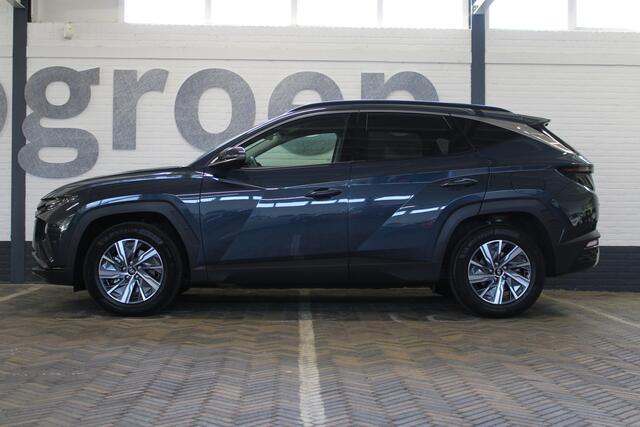 Hyundai TUCSON 1.6 T-GDI HEV Comfort Smart | Incl. 12 maanden garantie | Nieuwstaat | Achteruitrijcamera | Apple CarPlay | Stoel + stuurverwarming | Adaptive cruise | 1650 KG trekgewicht | F1 flippers | DAB radio | LED koplampen |