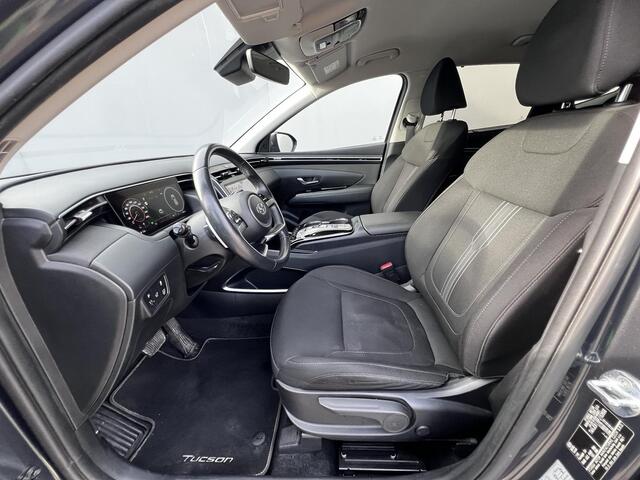 Hyundai TUCSON 1.6 T-GDI HEV 230pk Comfort Smart / Fabrieksgarantie tot 09-2028 / Dealer onderhouden / Trekgewicht 1650 KG / Navigatie / Achteruitrijcamera / Stuur- en stoelverwarming / Apple Carplay/Android auto / 19" LM /