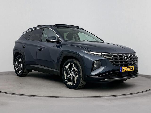 Hyundai TUCSON 1.6 T-GDI HEV Premium Sky | Trekhaak | Schuif/kanteldak | Elektrische stoelen | Navigatie | Dodehoek detectie | Stoel & stuurverwarming | Stoelventilatie |