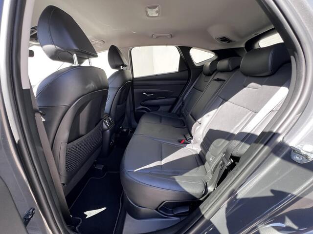 Hyundai TUCSON 1.6 T-GDI HEV 215pk Premium / Nieuw model / Fabrieksgarantie tot 7-2029 / Dealer onderhouden / Navigatie / Stuur- en stoelverwarming / Elektrische klep / Adaptieve CC / 19"LM wielen /