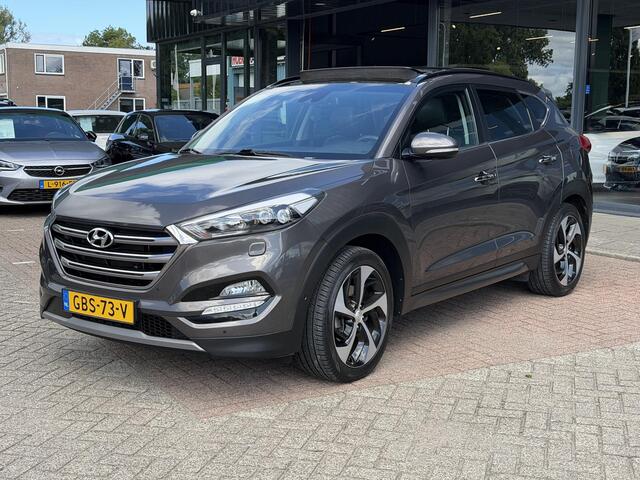 Hyundai TUCSON 1.6 T-GDi Premium 4WD LEDER | KEYLESS ENTRY/G | AUTOMAAT | AWD | CAMERA | ELEKTRISCH VERSTELBARE STOELEN | STOELVERWARMING | STUURVERWARMING | STUURKOELING | PANORAMADAK | NAVIGATIE | LED | XENON KOPLAMPEN | APPLE CARPLAY / ANDROID AUTO | CRUISECONTROL |