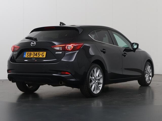 Mazda 3 2.0 SkyActiv-G 120 GT-M | Trekhaak | Bose Audio | Camera | HUD | Lederen Interieur | Stoelverwarming | LED | Navigatie | Adaptieve Cruise Control | Dodehoek detectie |