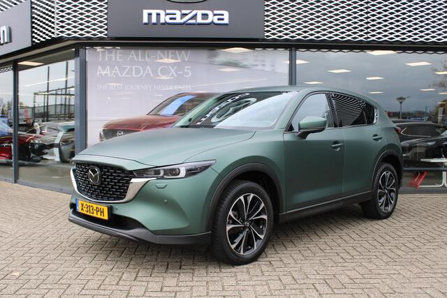 Mazda CX-5 2.0 e-SkyActiv-G M Hybrid 165 Exclusive-Line+Com.P , Automaat, Matte Metallic Pine Green gewrapped, Black Comfort Pack, Navi, Adap.Cruise, Clima, Apple Carplay, 360 Camera, PDC, HUD, Stuur/Stoelverwarming, 19" LMV