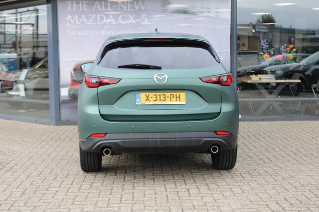 Mazda CX-5 2.0 e-SkyActiv-G M Hybrid 165 Exclusive-Line+Com.P , Automaat, Matte Metallic Pine Green gewrapped, Black Comfort Pack, Navi, Adap.Cruise, Clima, Apple Carplay, 360 Camera, PDC, HUD, Stuur/Stoelverwarming, 19" LMV