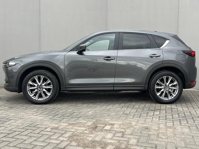 Mazda CX-5 2.0 SkyActiv-G 165 Comfort / Trekhaak (2.000KG) / Cruise Control / Lane Assist / Dode Hoek Detectie / Stuur-, Stoel Verwarming / Airco / Bluetooth / Full-Map Navigatie / Elektr-Bestuurderstoel Met Geheugen /
