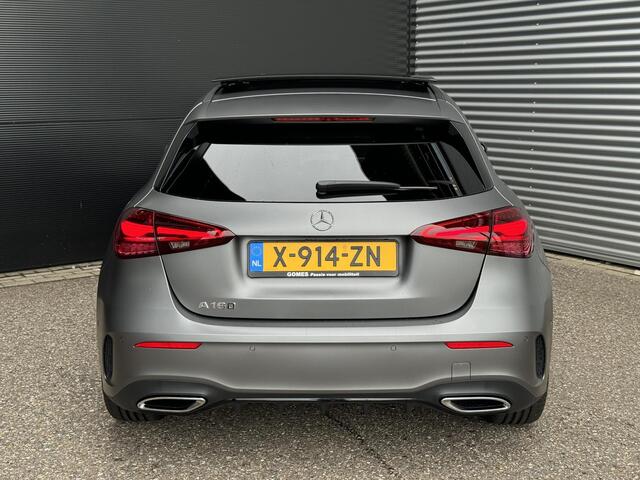 Mercedes-Benz A-KLASSE 180 | Panoramadak | AMG Line Mercedes-Benz A-klasse 180 AMG Line | Premium PLUS | Nightpakket | Panoramadak | Distronic | Achteruitrijcamera | Memorystoelen Verwarmd | Sfeerverlichting | Burmester | Apple & Android Carplay | Multispaaks | Trekhaak