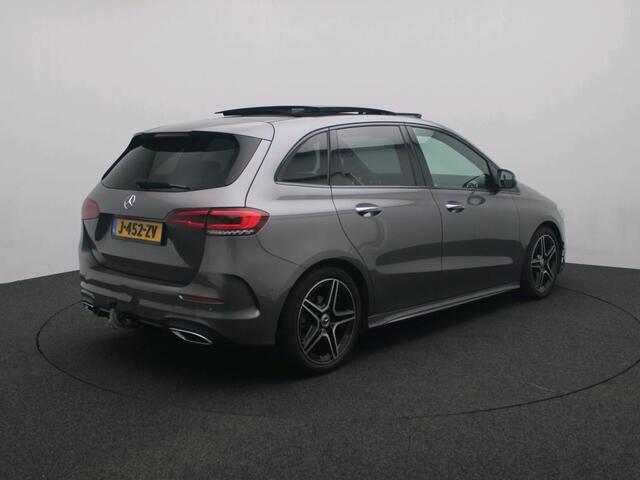 Mercedes-Benz B-KLASSE 180 Business Solution AMG Trekhaak | AMG | Night Pakket | Panorama Schuif-Kanteldak | Sfeerverlichting | Memory Voorstoelen. Inclusief 24 maanden Mercedes-Benz Certified garantie voor Europa.
