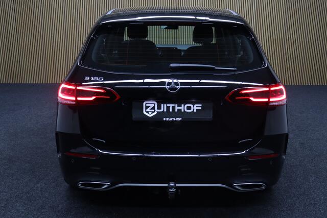 Mercedes-Benz B-KLASSE 180 Business Solution AMG | Afneembare Trekhaak | Cruise-control | Camera | Clima | Navigatie | Apple Carplay & Android Auto | Leder-Alcantara | Parkeersensoren V+A | AMG Velgen | Stoelverwarming