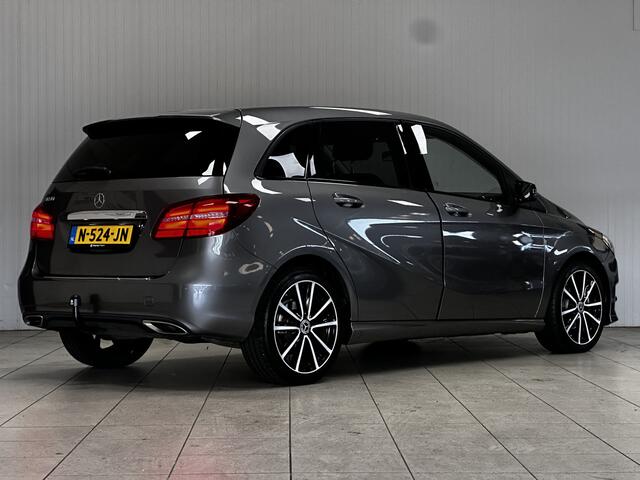 Mercedes-Benz B-KLASSE 180 Ambition/ Automaat/ Trekhaak/ Apple + Android/ Sportstoelen/ Keyless-GO/ 18'' LMV/ PDC V+A/ LED Koplampen/ Bluetooth/ Extra getint glas/ Half-Leder.