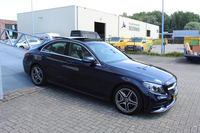 Mercedes-Benz C-KLASSE 180 Business Solution AMG Automaat/Panoramadak/Navigatie/Apple carplay/Virtueel dashboard/Multibeam LED/Cruise control/Climate control/Lederen bekleding/Stoelverwarming/Elektrisch verstelbare stoelen/Spiegels inklapbaar/Achteruitrijcamera/Parkeersensoren/