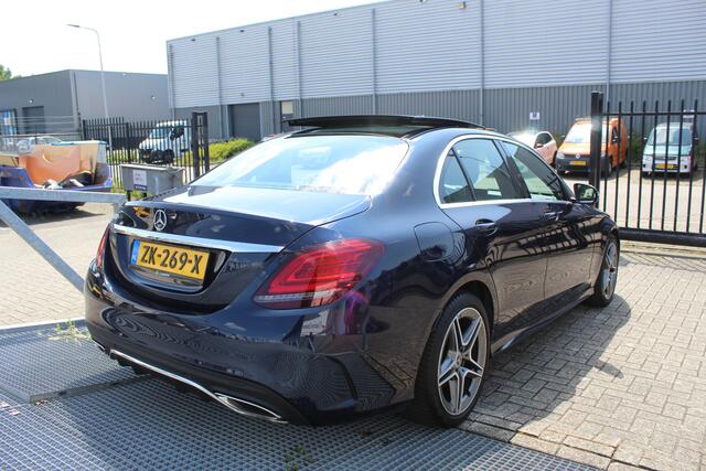 Mercedes-Benz C-KLASSE 180 Business Solution AMG Automaat/Panoramadak/Navigatie/Apple carplay/Virtueel dashboard/Multibeam LED/Cruise control/Climate control/Lederen bekleding/Stoelverwarming/Elektrisch verstelbare stoelen/Spiegels inklapbaar/Achteruitrijcamera/Parkeersensoren/