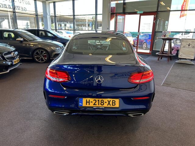 Mercedes-Benz C-KLASSE Coupé 180 AMG Exclusive | Automaat | Lederen bekleding | Dealer onderhouden | Adaptief onderstel | Achteruitrijcamera | Cruise control | Climate control | Houtafwerking interieur