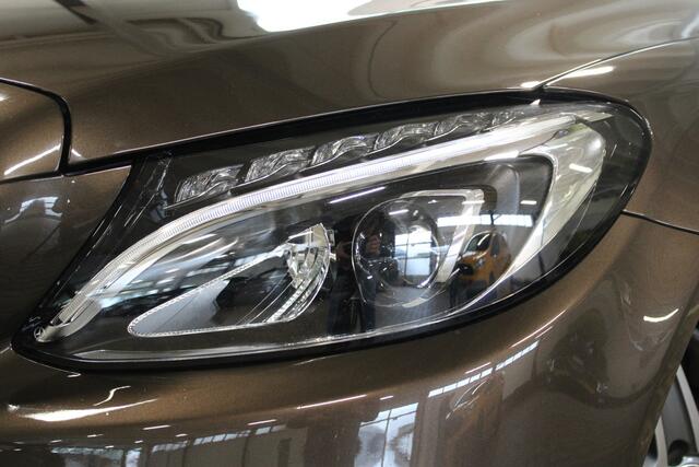 Mercedes-Benz C-KLASSE Estate 180 AMG Sport Edition | Incl. 12 maanden garantie | Automaat | Afneembare trekhaak | Navigatie | Cruise control | Climate control | Vol leder | Stoelverwarming | Zwarte hemel | 18'' LM | Parkeersensoren |
