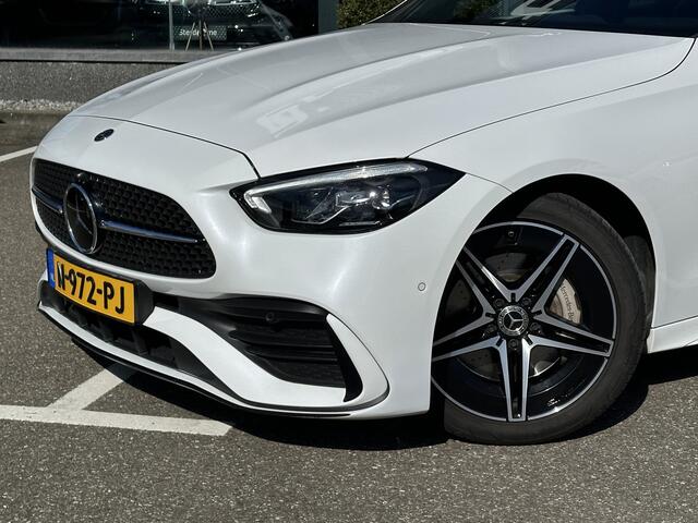 Mercedes-Benz C-KLASSE 220 d Estate AMG | MBUX l Panoramadak l Augmented Reality l Apple Car play l Stoelverwarming l Wegklapbare Trekhaak l Designo OpalithWit l Night pakket l LED High Performance l Distronic Plus l Easy Pack l Business pakket l Spiegel pakket l