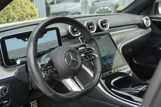 Mercedes-Benz C-KLASSE 220 d Estate AMG | MBUX l Panoramadak l Augmented Reality l Apple Car play l Stoelverwarming l Wegklapbare Trekhaak l Designo OpalithWit l Night pakket l LED High Performance l Distronic Plus l Easy Pack l Business pakket l Spiegel pakket l