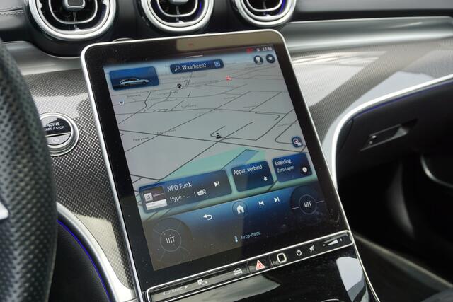 Mercedes-Benz C-KLASSE 220 d Estate AMG | MBUX l Panoramadak l Augmented Reality l Apple Car play l Stoelverwarming l Wegklapbare Trekhaak l Designo OpalithWit l Night pakket l LED High Performance l Distronic Plus l Easy Pack l Business pakket l Spiegel pakket l