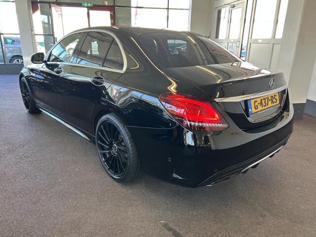 Mercedes-Benz C-KLASSE 200 Premium Plus Pack AMG Facelift | Cruise control | Climate control | Achteruitrijcamera | Adaptief onderstel | Navigatie | Sfeerverlichting | 19''INCH AMG | Stoelverwarming